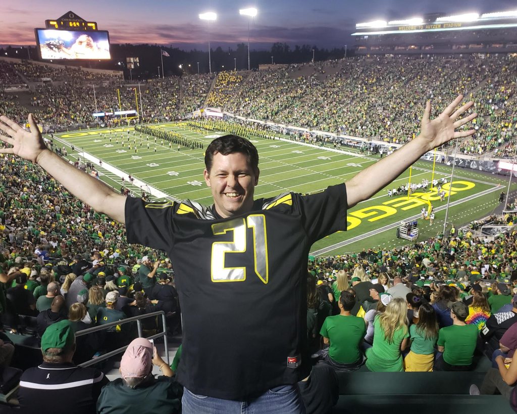 man enjoying himself at a footabll game